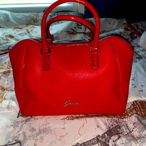 Red Guess hand bag brand new minor scratches from moving